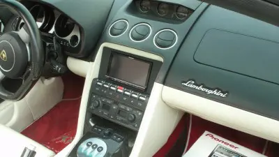 A car dashboard with the radio and other controls.