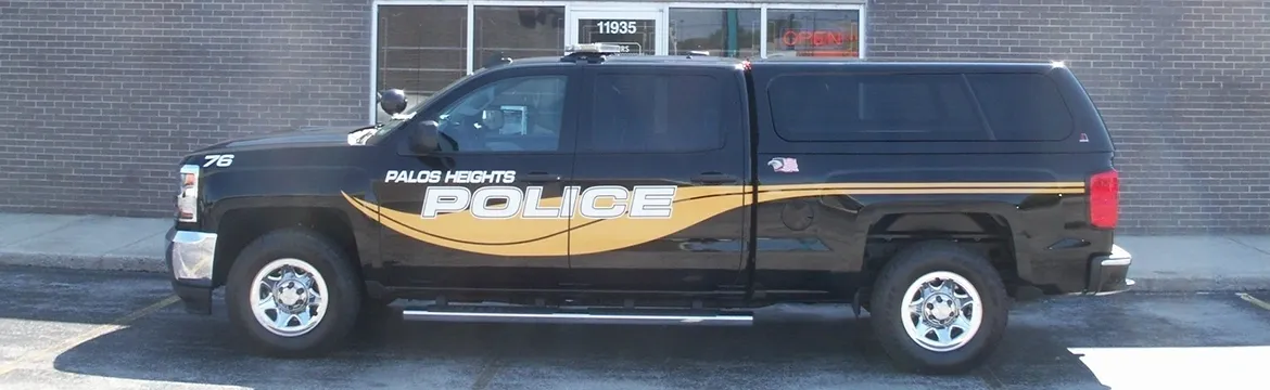 A police truck parked in front of a building.